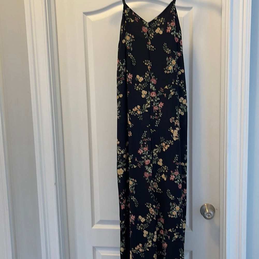 Black floral romper with spaghetti strap.